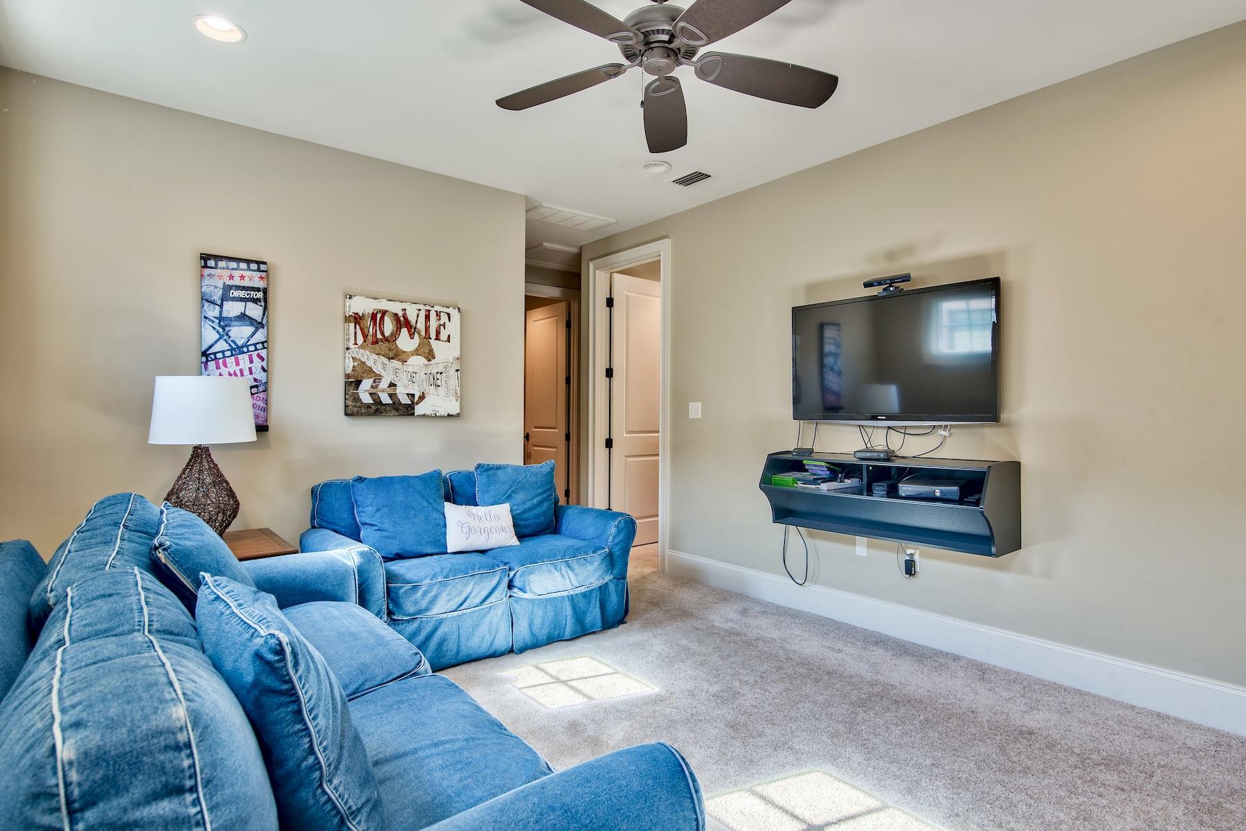 1973 Baytowne Loop Miramar Beach, FL 32550 - Photo 12 of 40 a living room with furniture and a flat screen tv