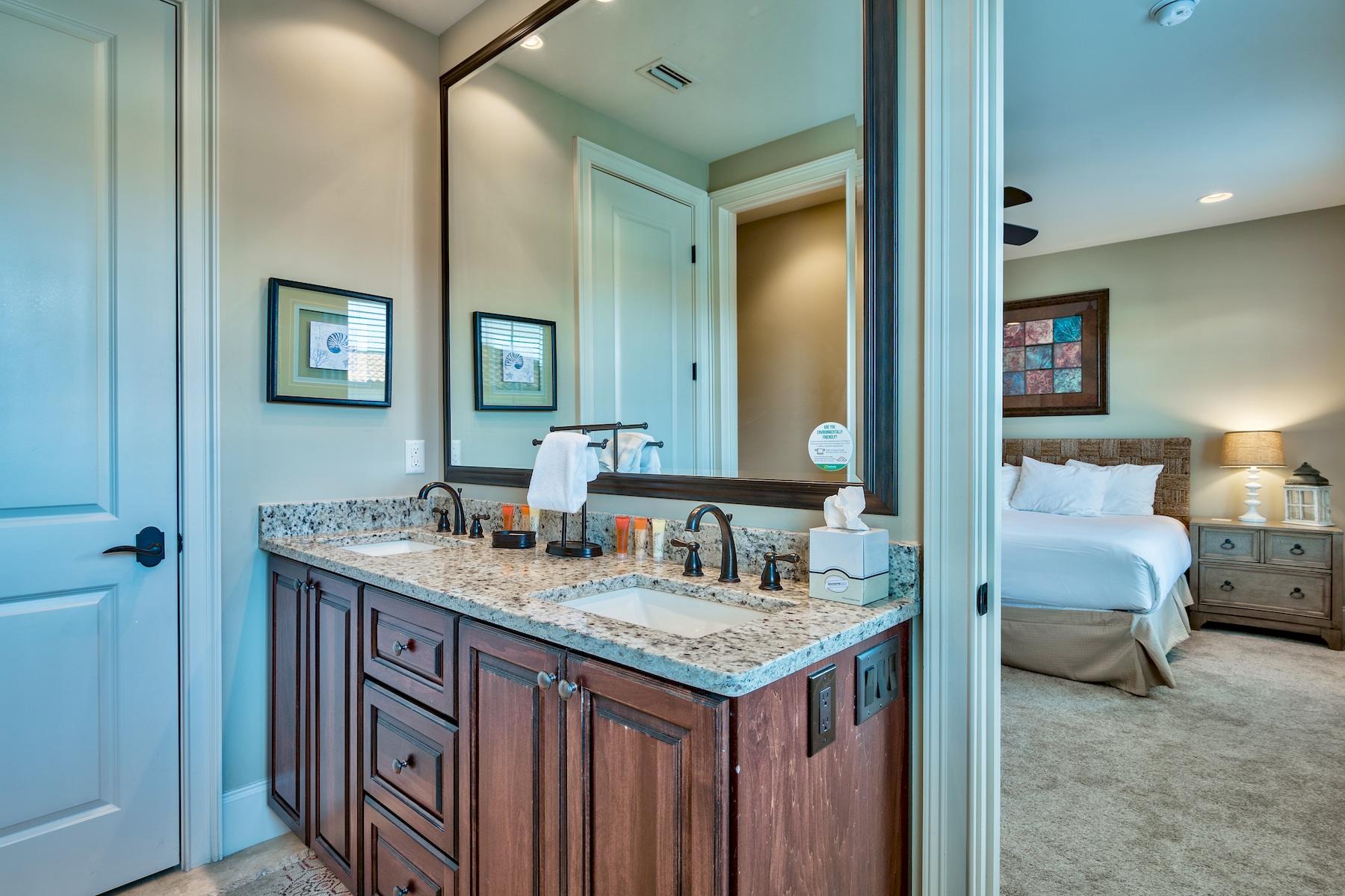 1973 Baytowne Loop Miramar Beach, FL 32550 - Photo 18 of 40 a bathroom with a granite countertop sink and a mirror