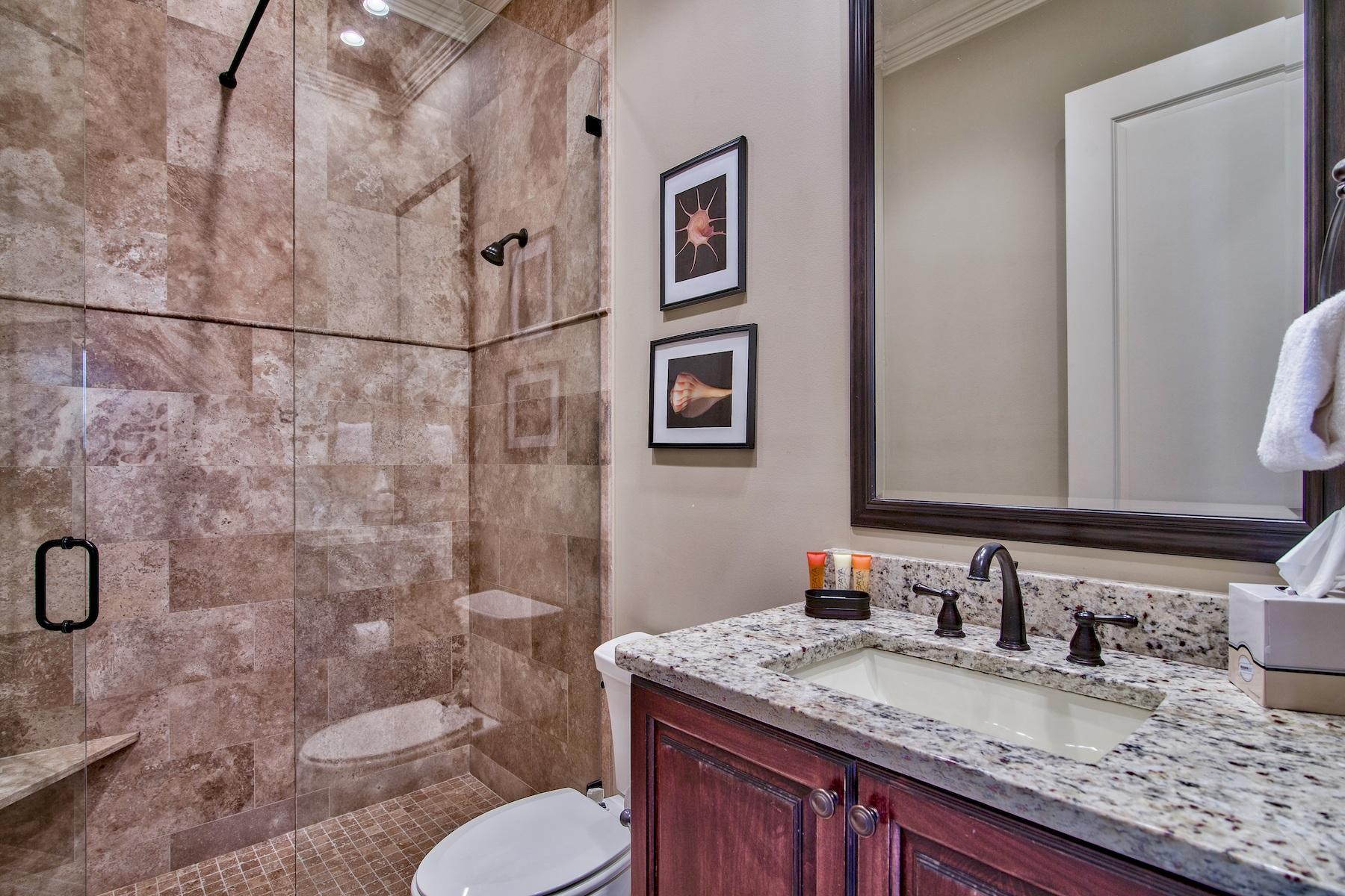 1973 Baytowne Loop Miramar Beach, FL 32550 - Photo 22 of 40 a bathroom with a granite countertop sink toilet and shower