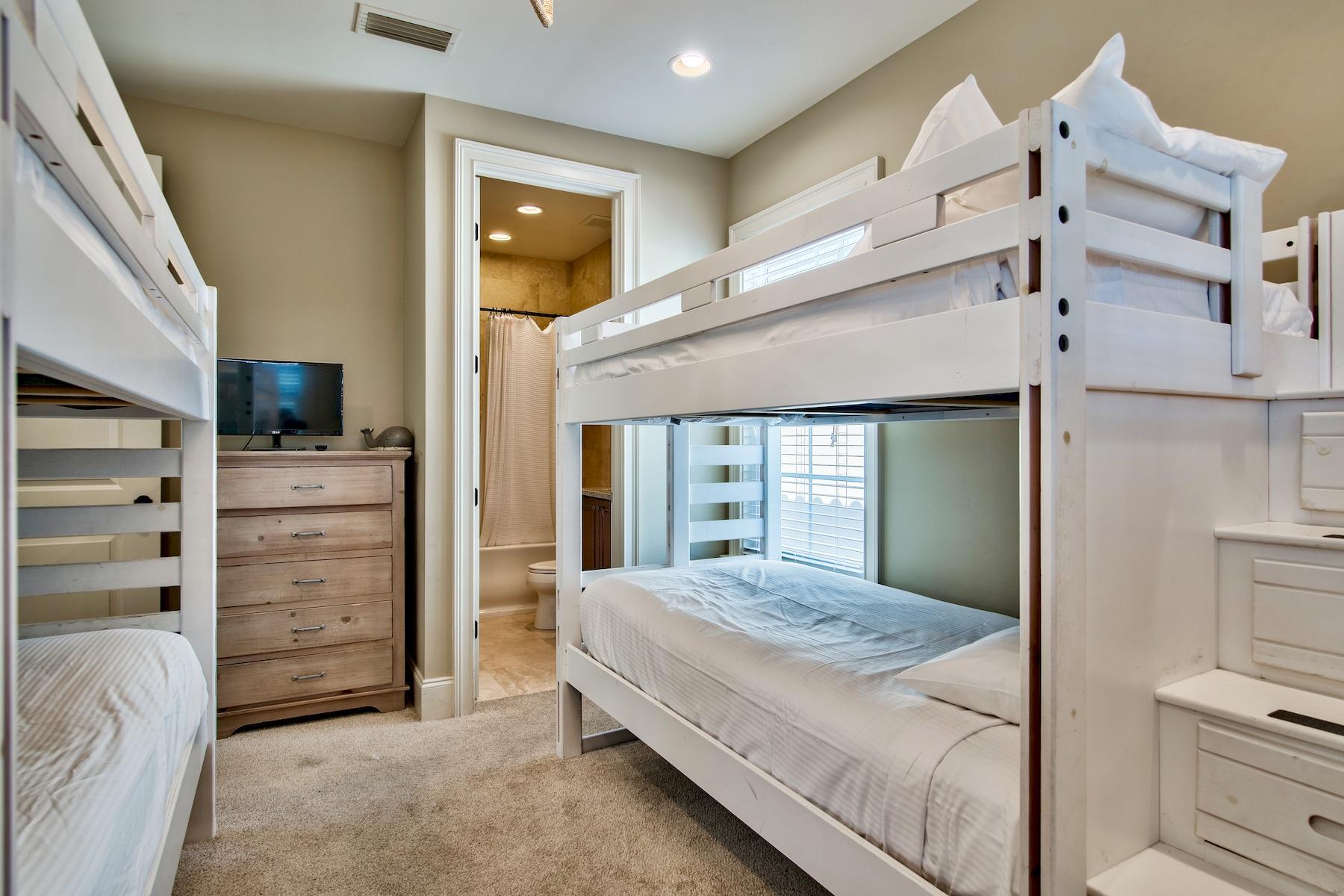 1973 Baytowne Loop Miramar Beach, FL 32550 - Photo 27 of 40 a bedroom with a bed and a walk in closet