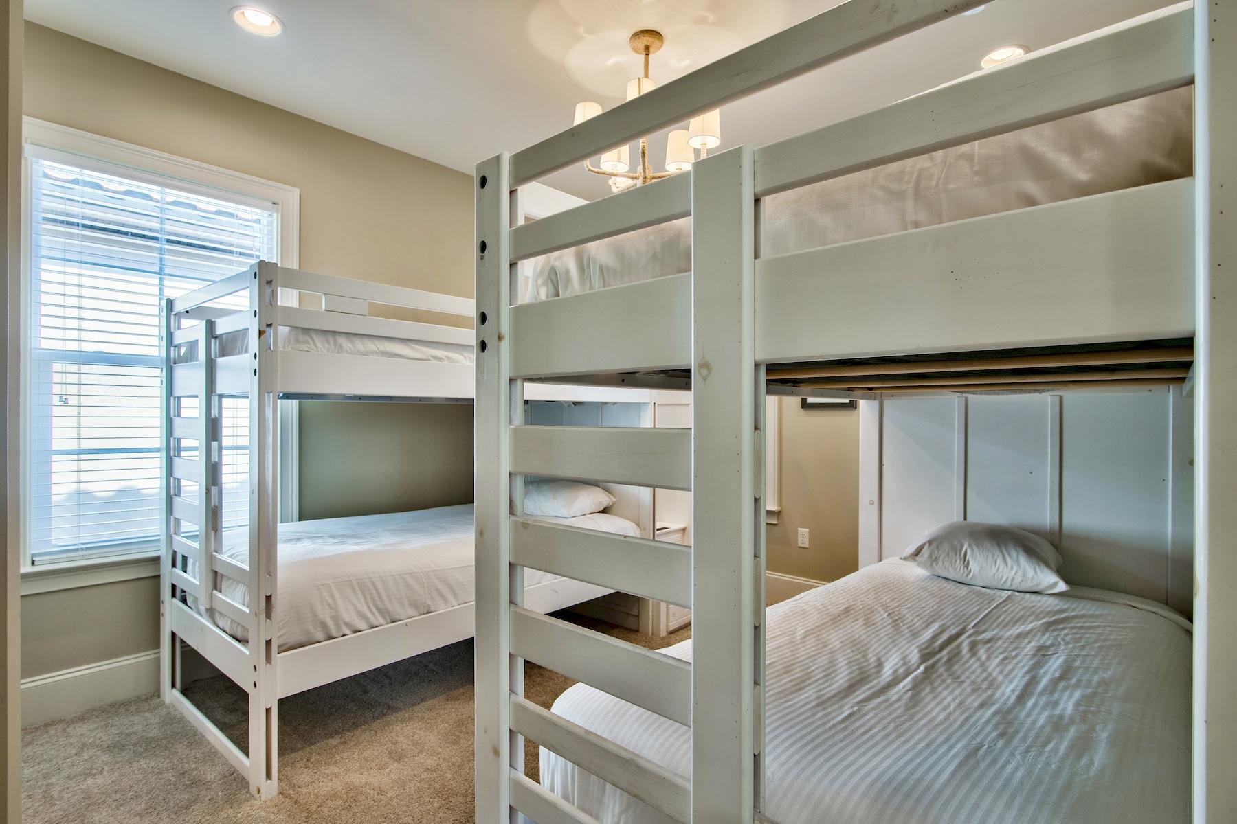 1973 Baytowne Loop Miramar Beach, FL 32550 - Photo 28 of 40 a bedroom with a bed and a flat tv screen on dresser