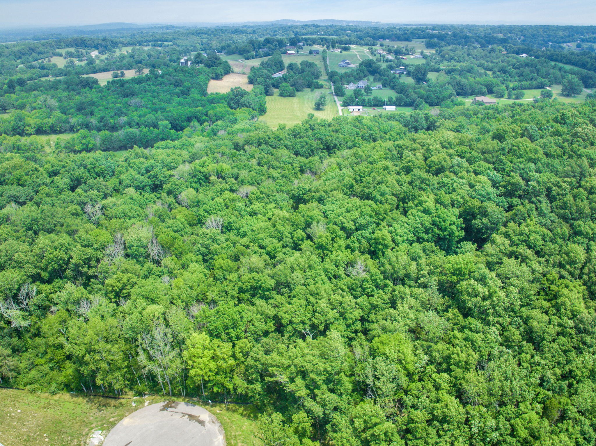 5536 Hickory Ridge Road Lebanon, TN 37090 - Photo 11 of 13 an aerial view of a house with a lush green forest