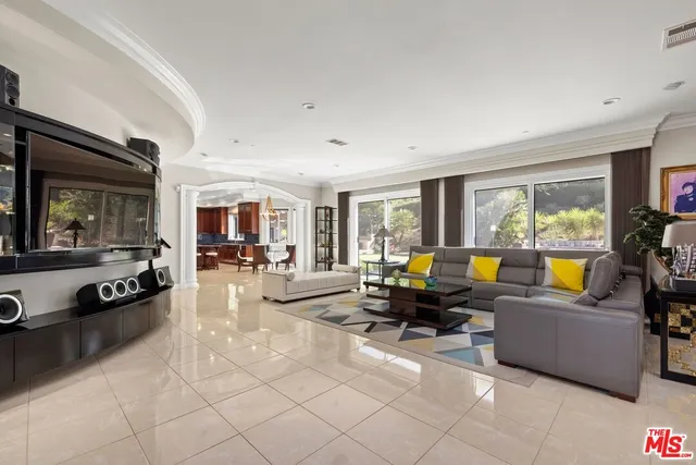 a view of a dining room with furniture and window