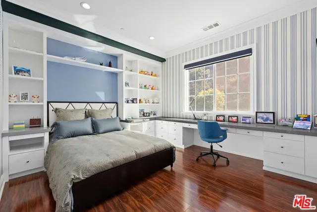 a view of a swimming pool with lounge chairs in patio