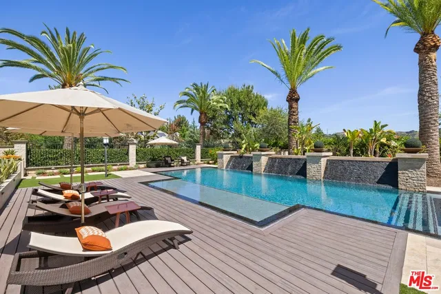 a view of swimming pool from a balcony