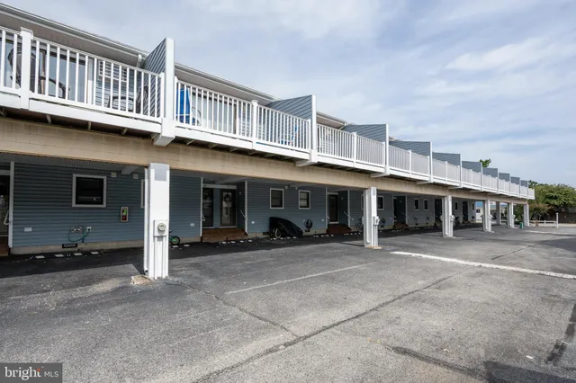 a front view of a house with lots of windows and a table