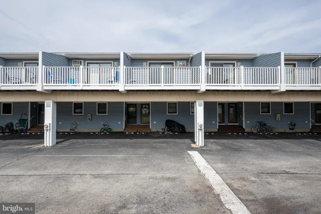 a front view of a house with glass windows