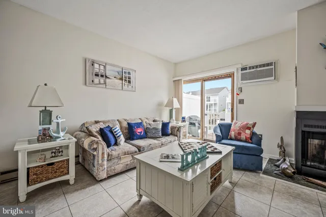 a view of a dining room with furniture a chandelier and wooden floor