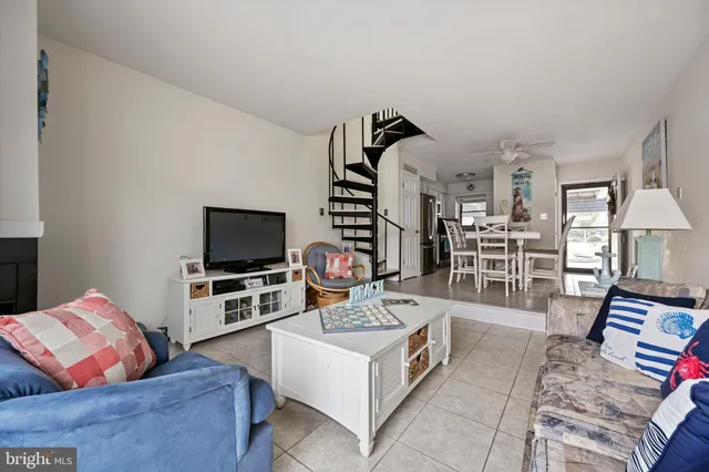 a bedroom with two beds and a chandelier