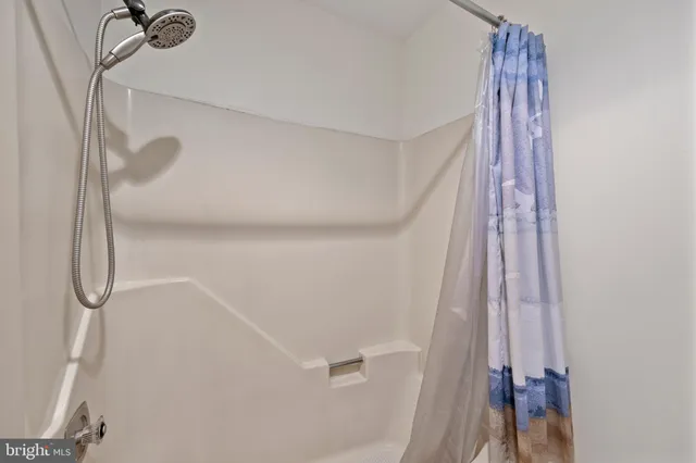 a view of storage and utility room with washer and dryer