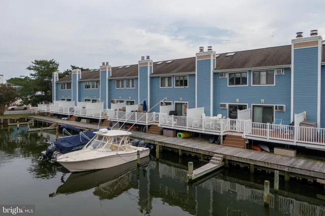 a view of a deck with furniture and wooden deck