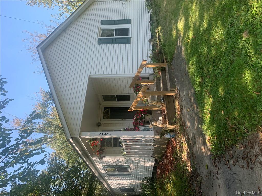 247 Shaw Road Middletown, NY 10941 - Photo 1 of 1 a front view of a house with patio outdoor seating