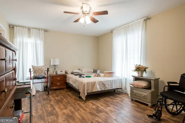 a bedroom with bed and window