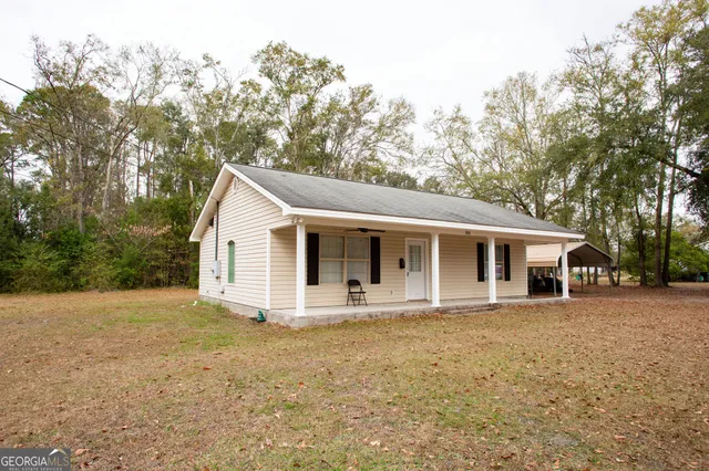 a front view of a house with yard
