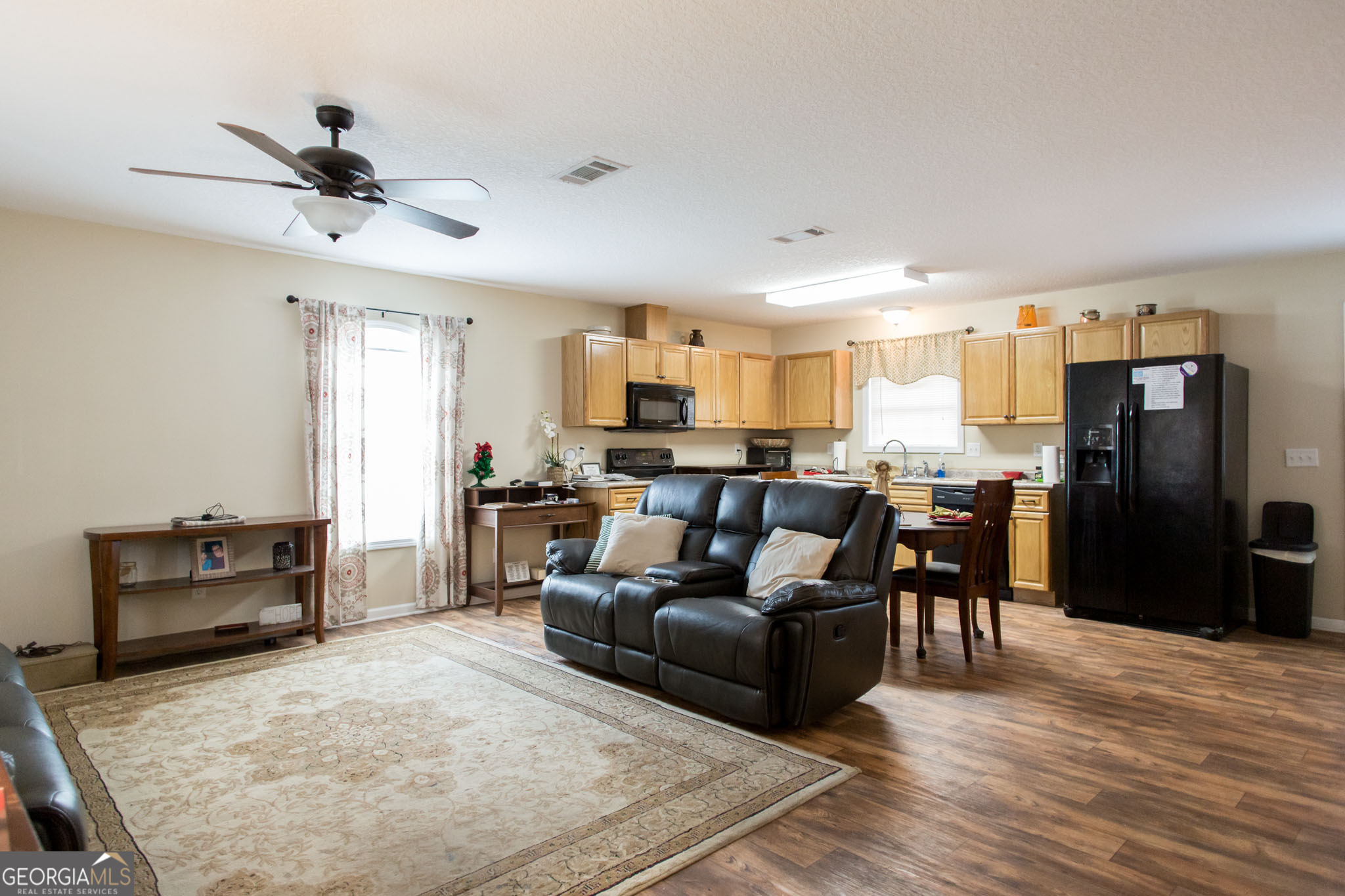 920 Wilfred Street Waycross, GA 31503 - Photo 6 of 17 a living room with furniture and kitchen view