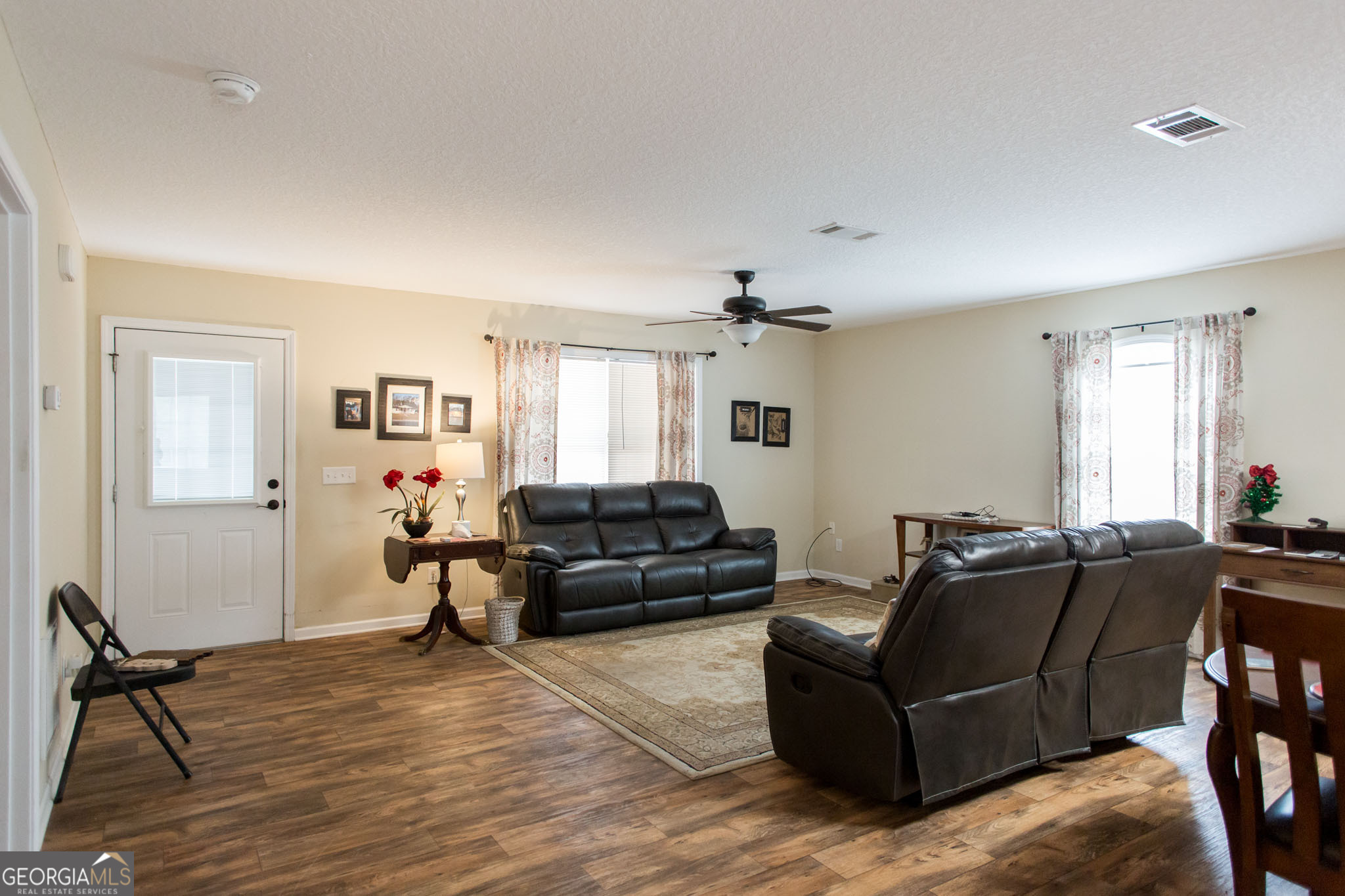 920 Wilfred Street Waycross, GA 31503 - Photo 7 of 17 a living room with furniture window and wooden floor