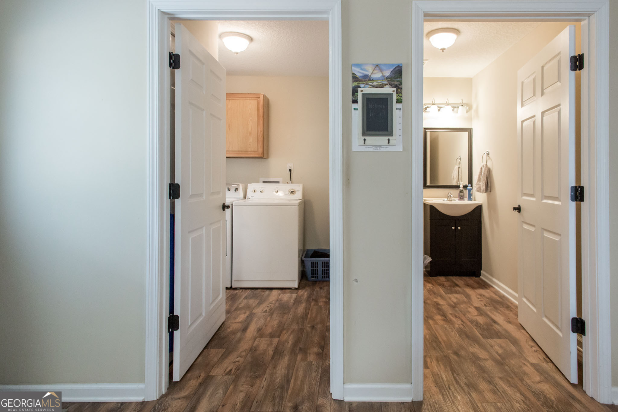920 Wilfred Street Waycross, GA 31503 - Photo 10 of 17 a view of a hallway with wooden floor and cabinets