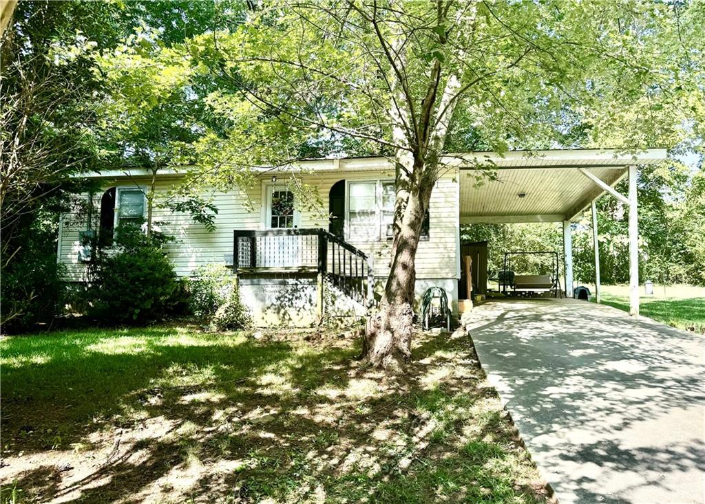 2715 Squires Road Gainesville, GA 30507 - Photo 1 of 1 a front view of a house with garden