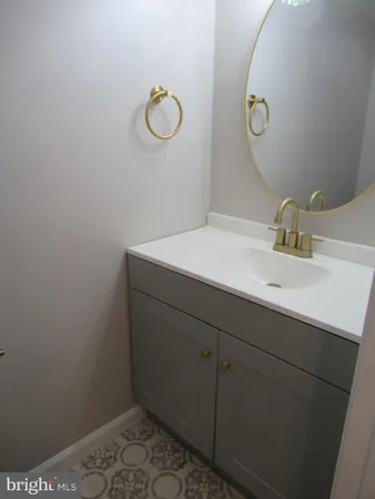 a bathroom with a sink and vanity