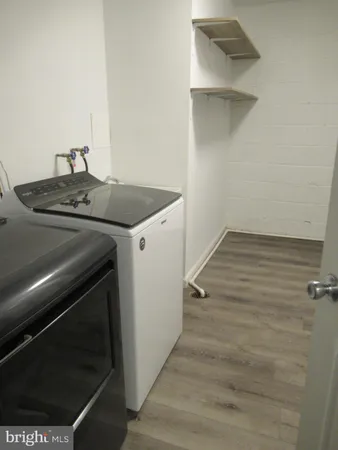 a kitchen with a stove and a refrigerator