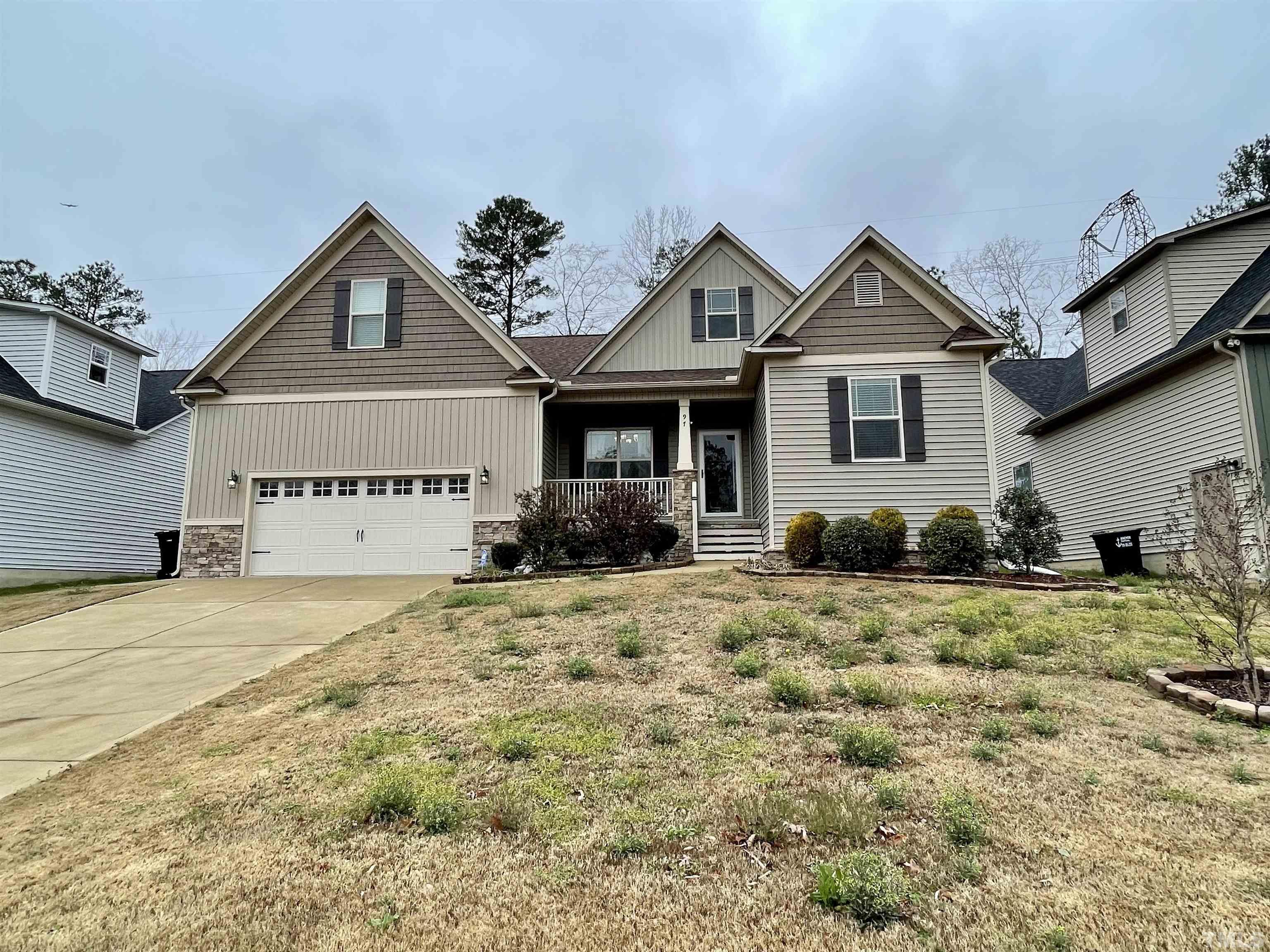 97 Thunder Ridge Drive Garner, NC 27529 - Photo 1 of 33 a view of a house with a yard