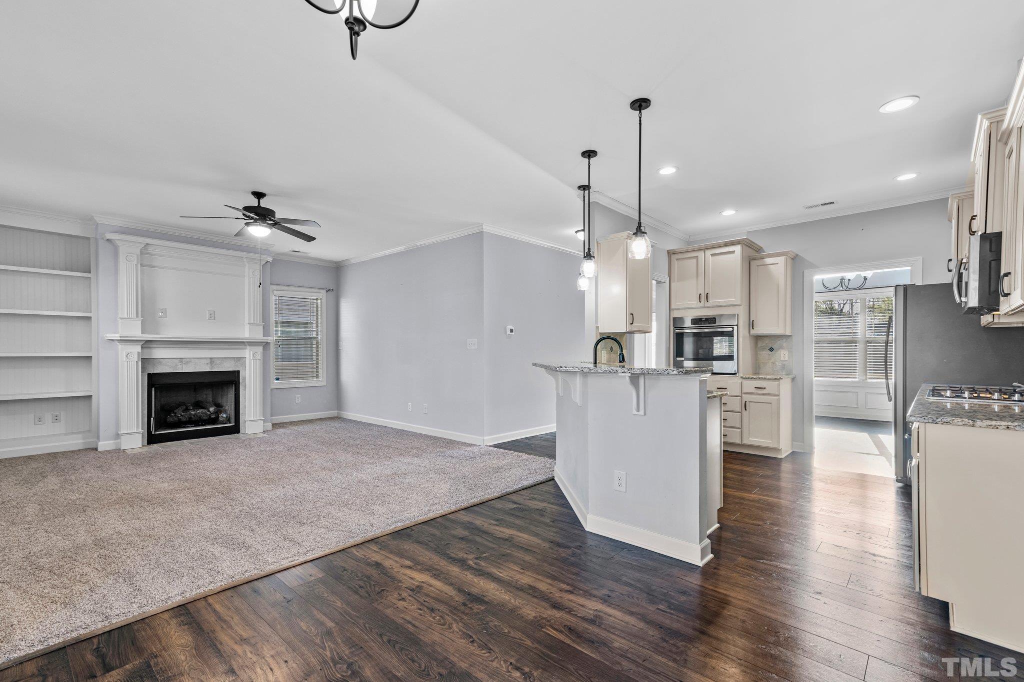 97 Thunder Ridge Drive Garner, NC 27529 - Photo 15 of 33 a view of kitchen and hall with wooden floor