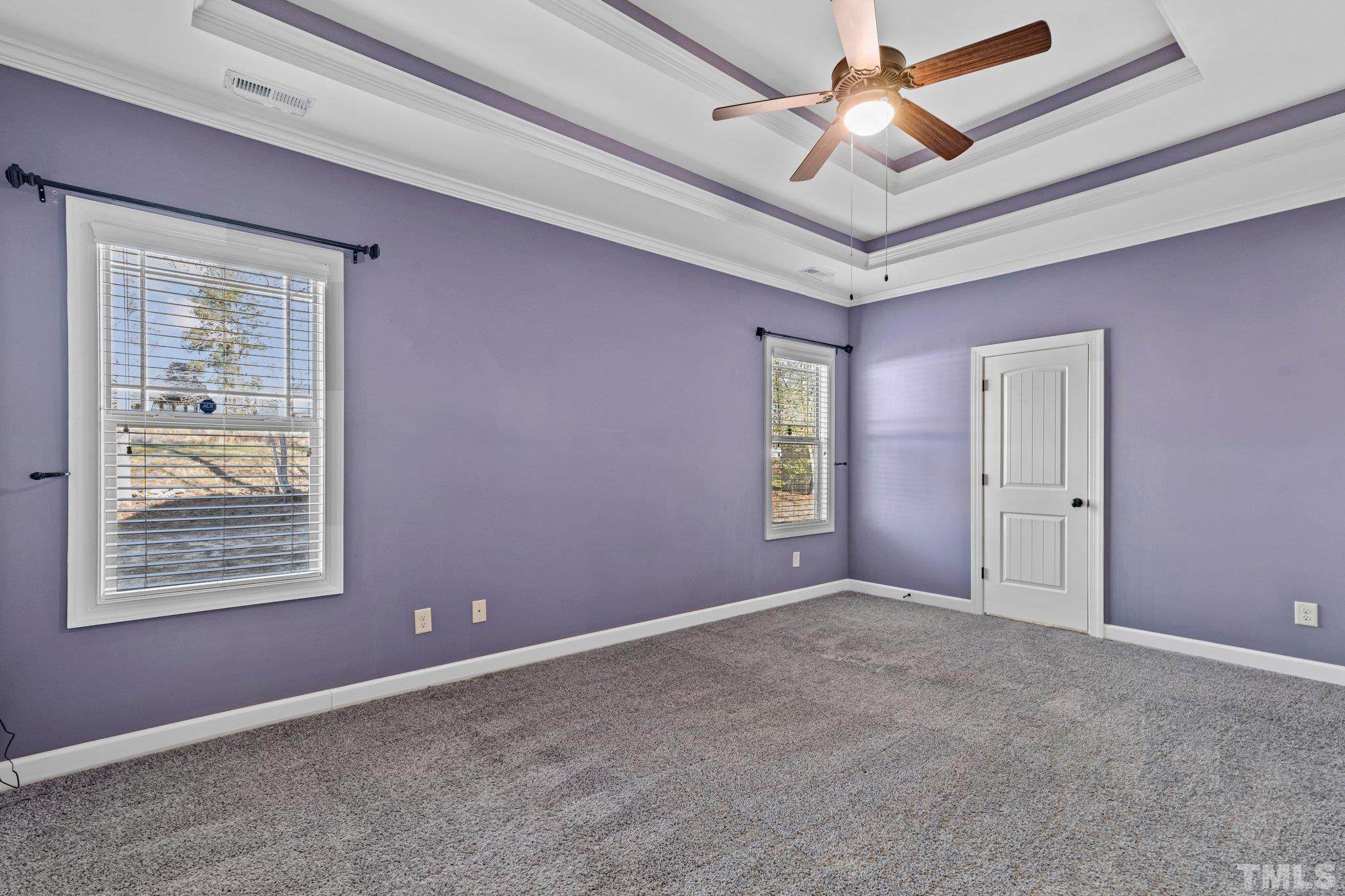 97 Thunder Ridge Drive Garner, NC 27529 - Photo 17 of 33 an empty room with windows and fan