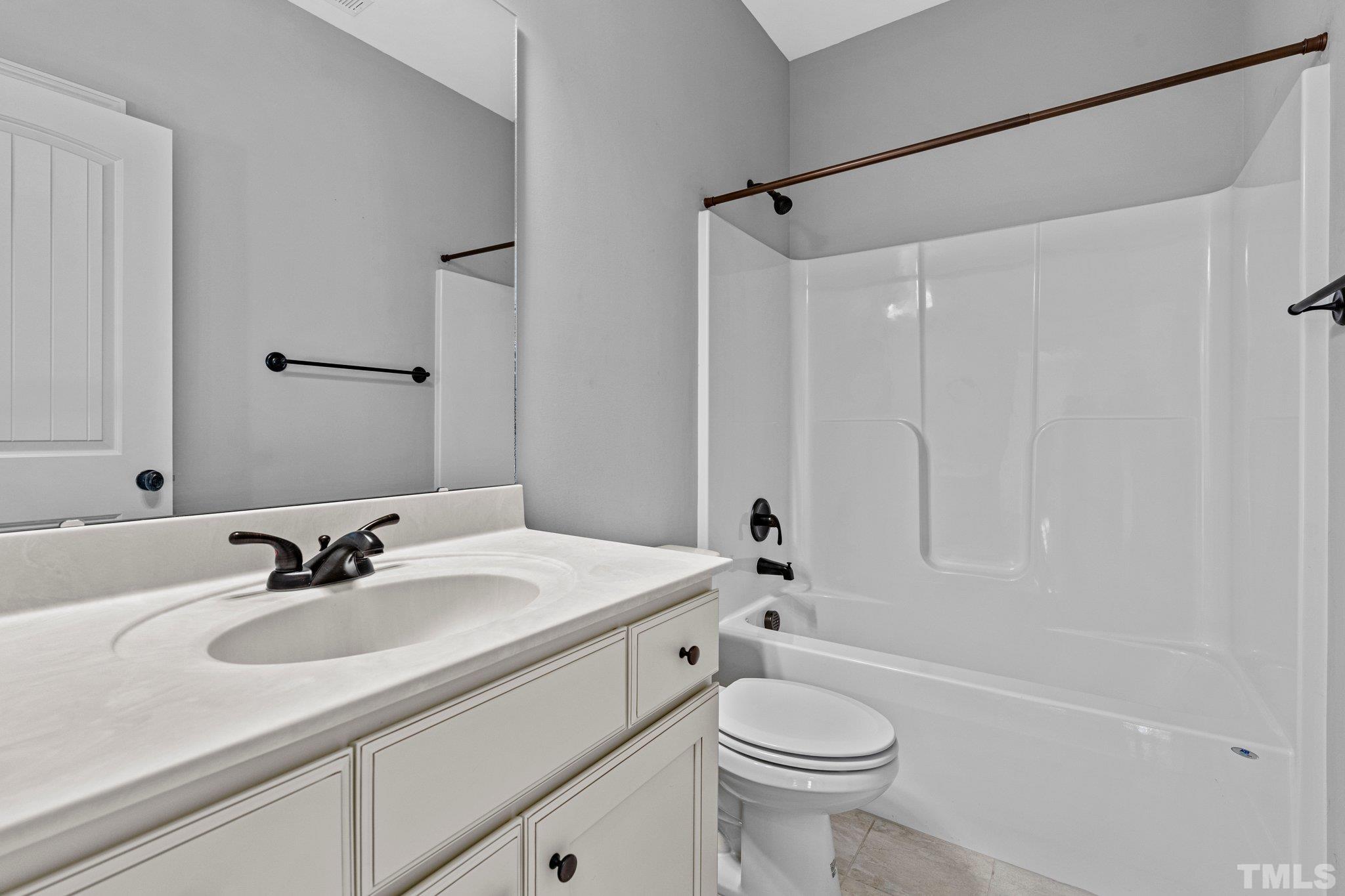 97 Thunder Ridge Drive Garner, NC 27529 - Photo 24 of 33 a bathroom with a sink toilet and shower