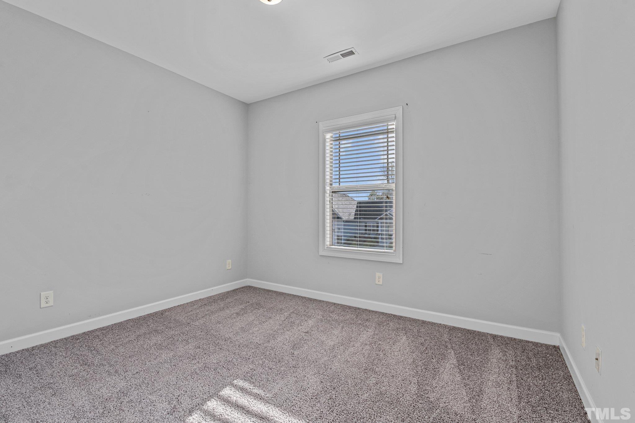 97 Thunder Ridge Drive Garner, NC 27529 - Photo 27 of 33 an empty room with a window