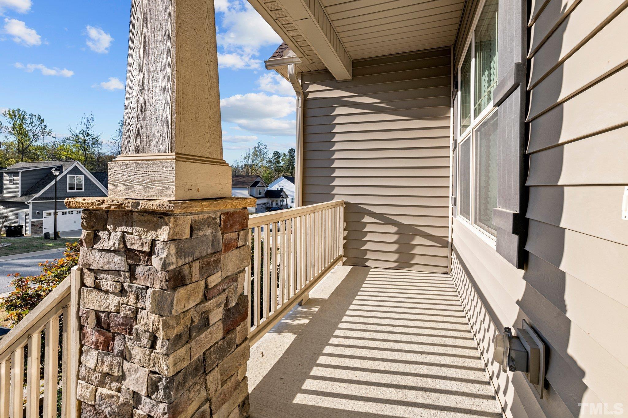 97 Thunder Ridge Drive Garner, NC 27529 - Photo 3 of 33 a view of a balcony with two chairs