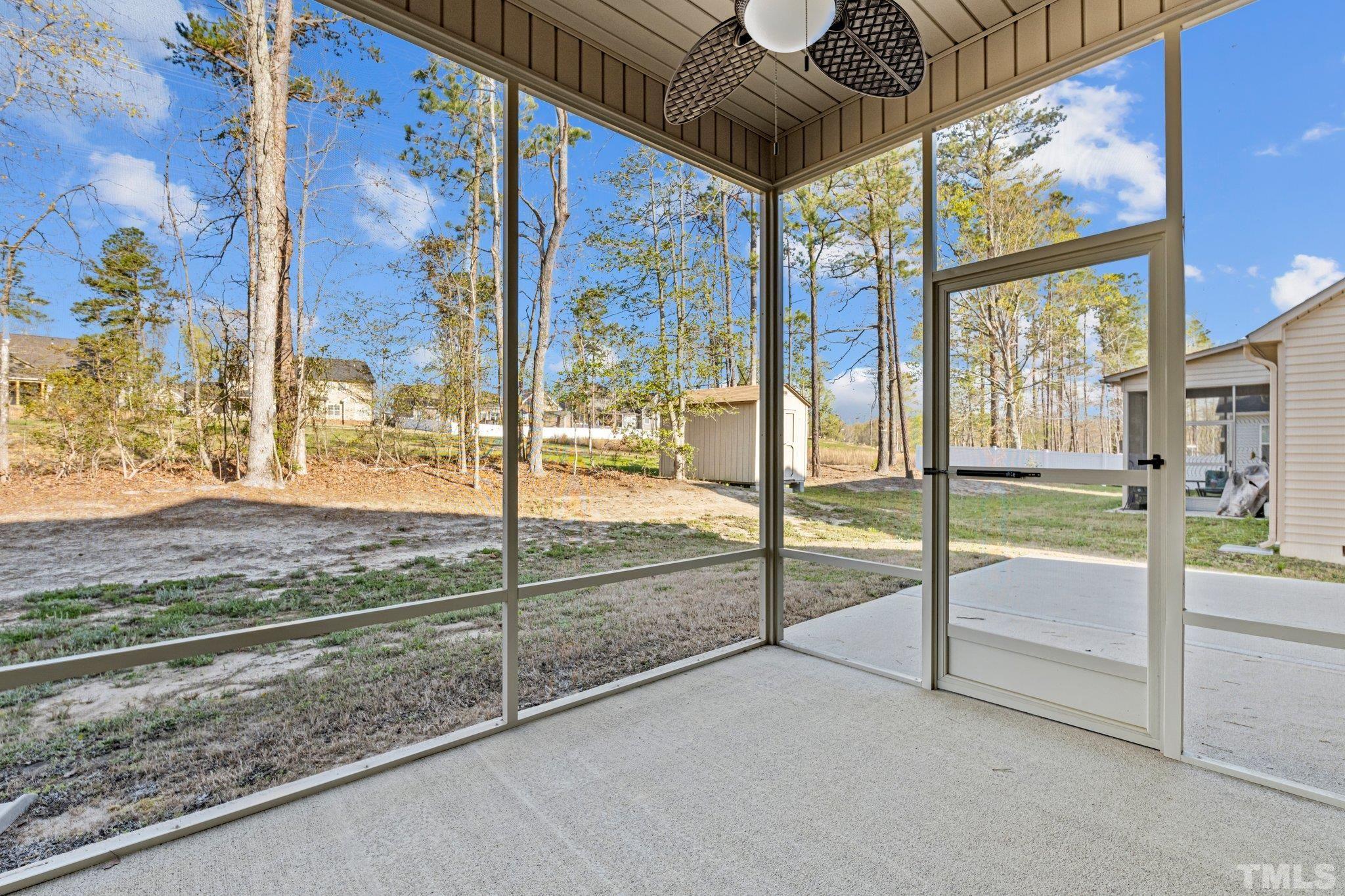 97 Thunder Ridge Drive Garner, NC 27529 - Photo 33 of 33 a view of an empty room with floor to ceiling windows with yard
