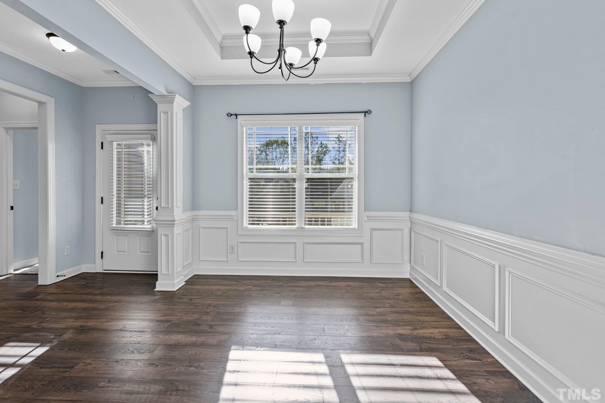 97 Thunder Ridge Drive Garner, NC 27529 - Photo 5 of 33 a view of an empty room with wooden floor and a window