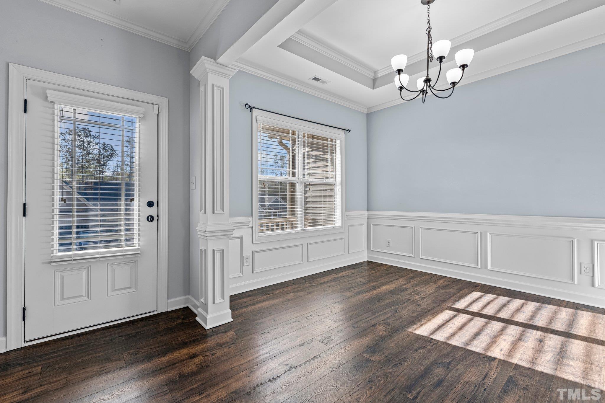 97 Thunder Ridge Drive Garner, NC 27529 - Photo 6 of 33 a view of an empty room with wooden floor and a window