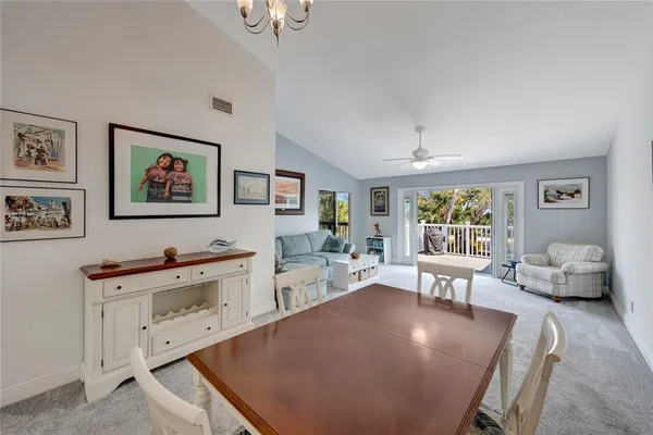 a view of kitchen with furniture and refrigerator
