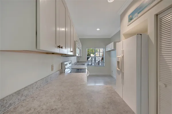 a white toilet sitting next to a bathroom sink
