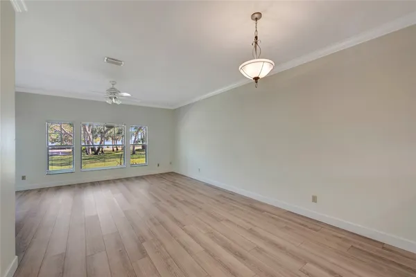 a kitchen with granite countertop a stove top oven a sink a counter space and cabinets