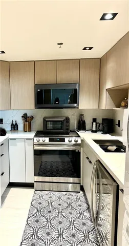 a kitchen with a stove and a sink