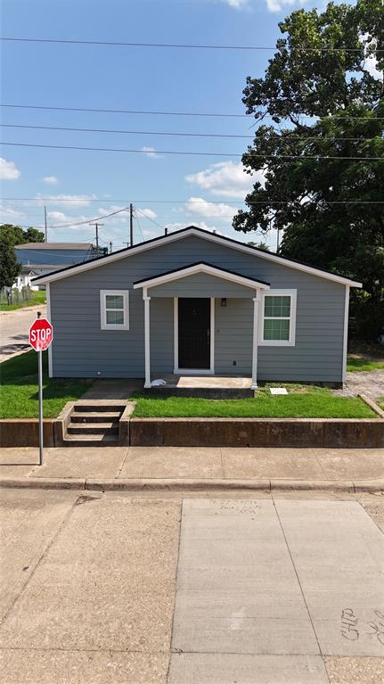 3113 Navaro Street Dallas, TX 75212 - Photo 12 of 12 a front view of a house with a yard