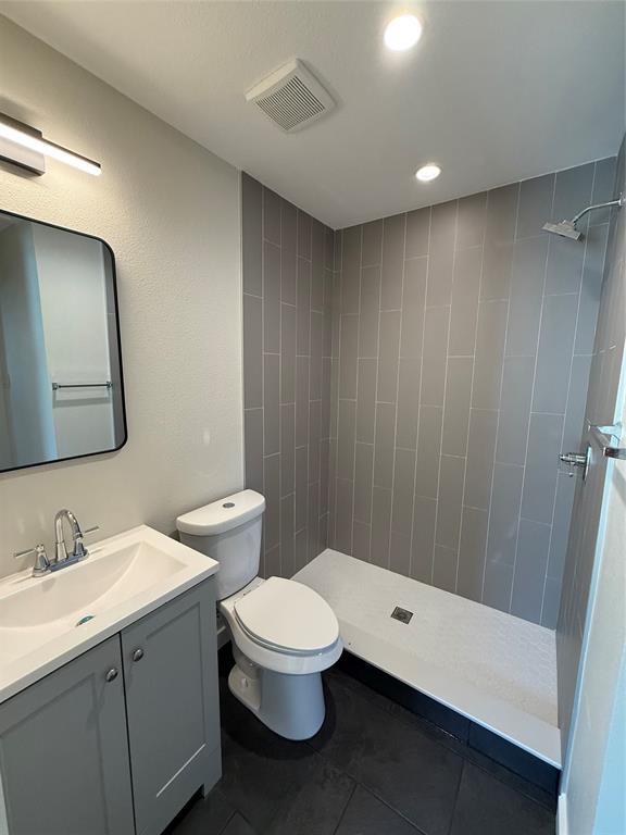 3113 Navaro Street Dallas, TX 75212 - Photo 9 of 12 a bathroom with a sink a toilet and shower