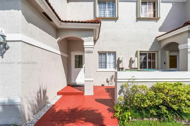 a front view of a house with glass windows