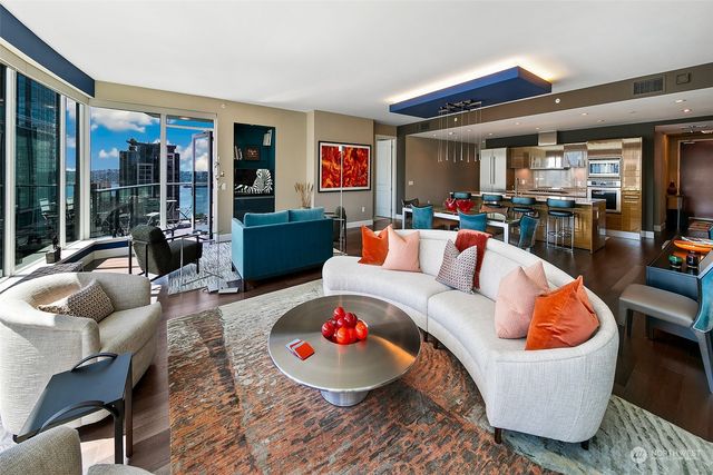 a living room with furniture and a large window