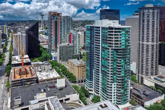 a view of city with tall buildings