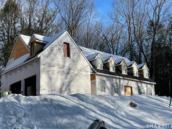 a view of house with yard