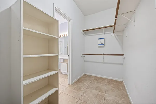 a view of an empty walk in closet