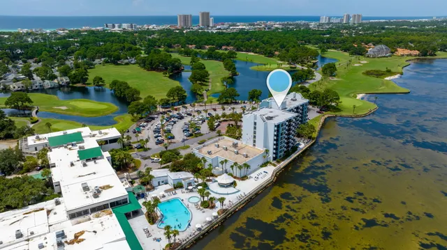 an aerial view of a house with yard swimming pool and outdoor seating