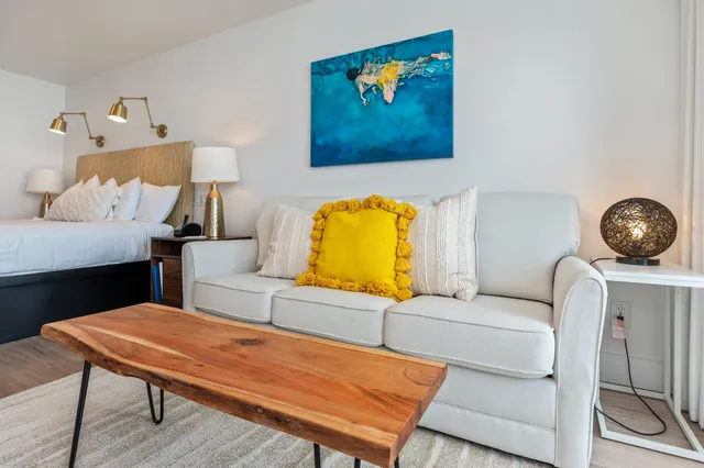 a living room with a couch and a table