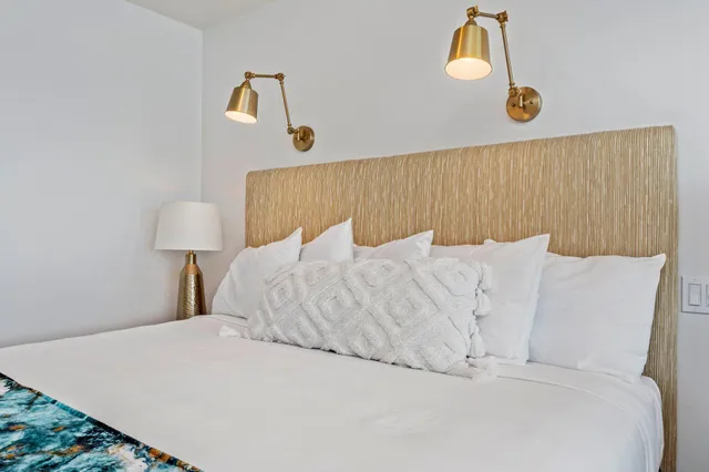 a bed room with a bed and a window