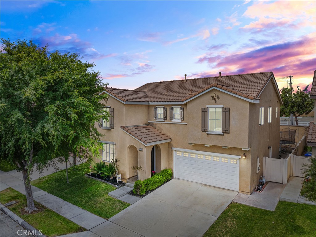 1132 North Yucca Avenue Rialto, CA 92376 - Photo 1 of 1 a front view of a house with a yard