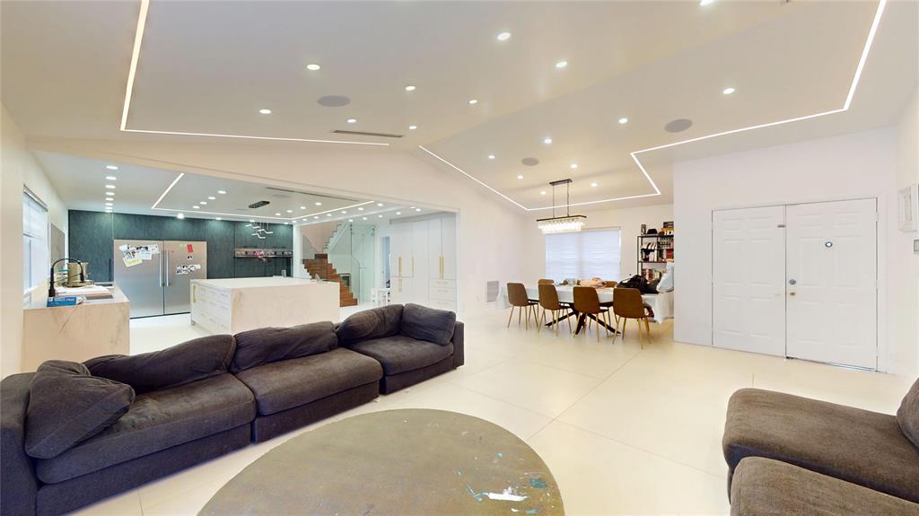 4060 Southwest 70th Terrace Davie, FL 33314 - Photo 13 of 22 a living room with furniture and a dining table