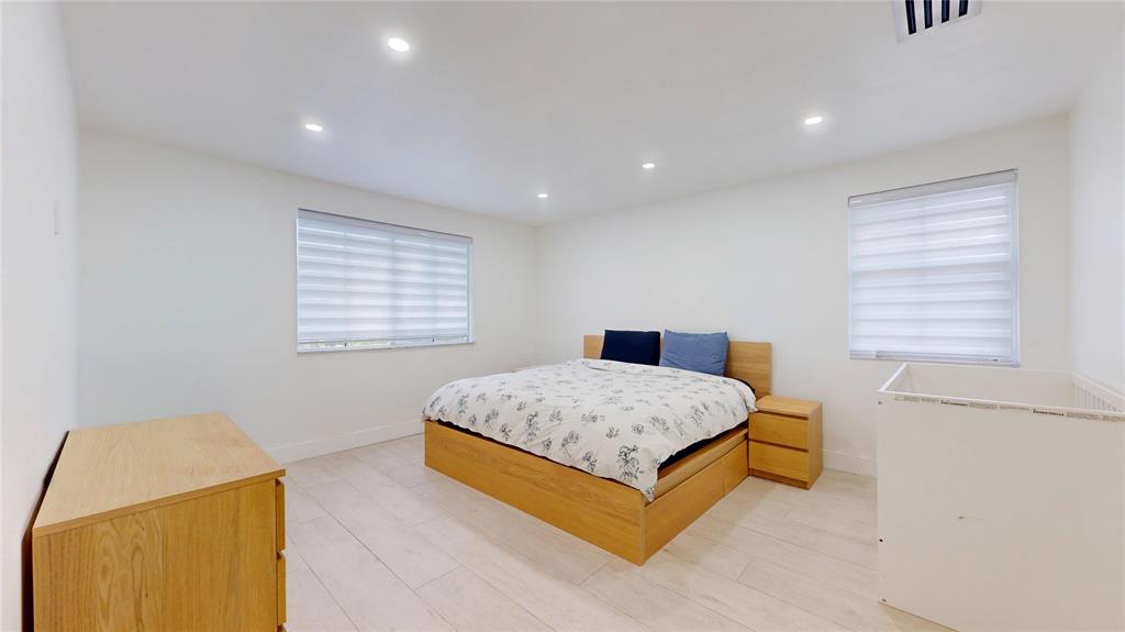 4060 Southwest 70th Terrace Davie, FL 33314 - Photo 14 of 22 a spacious bedroom with a bed and a window